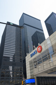 exterior building facade and corporate logo sign of BMO Financial Group outside headquarters at First Canadian Place, northwest corner of 100 King St W and Bay St, Toronto; Toronto-Dominion Centre