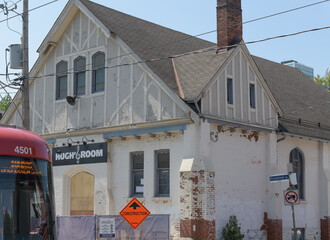 Fototapeta premium exterior building facade and sign of Hugh's Room Live, a music venue, and former place of worship, located at 296 Broadview Av, Toronto