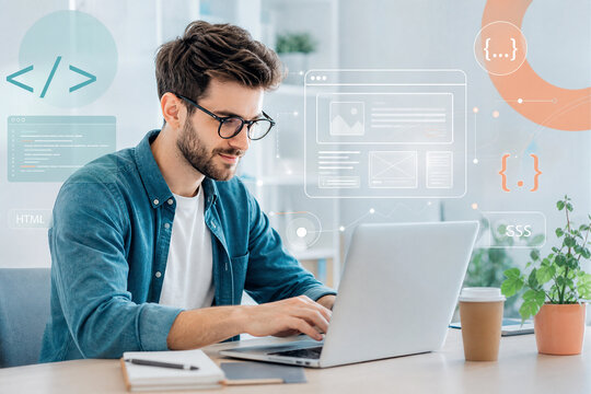 Web developer working on laptop with website graphic overlays