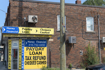 Fototapeta premium signage outside Money Financial, a loan agency, located at 1023 Pape Av (East York), Toronto
