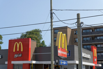Fototapeta premium signs outside a McDonald's Canada fast food restaurant location at 1045 Pape Av E (East York), Toronto