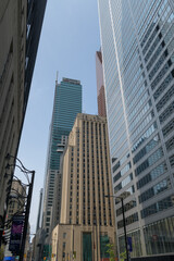 Fototapeta premium historic and contemporary office towers in Financial District Toronto (Bank of Nova Scotia, Commerce Court West and Toronto-Dominion Centre) or looking north on Bay St