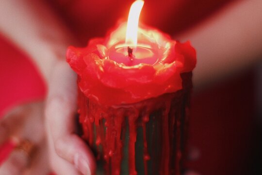 red candle in a shape of rose, love ritual