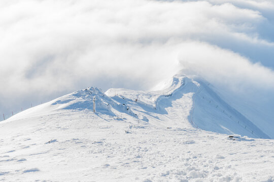  Winter mountain ridge above the clouds in Zakopane, Poland