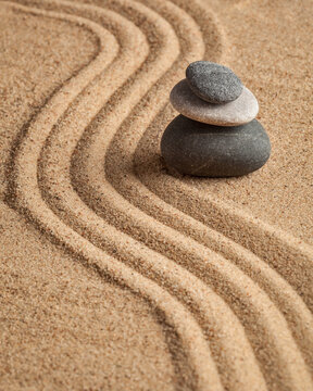 Japanese Zen stone garden - relaxation, meditation, simplicity alongside balance concept - pebbles and raked sand tranquil calm scene, with activities