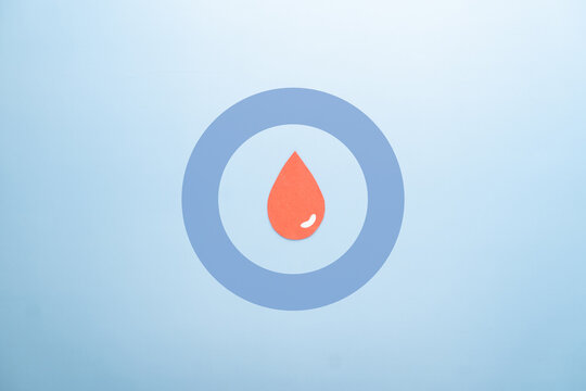 World diabetes day awareness concept. Blood drop and blue circle of universal symbol for diabetes. Support for the fight against diabetes.