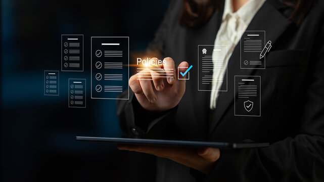 A business professional engages with digital documents on a tablet, showcasing modern technology in document management, strategies, and policy implementation within an office setting. Cyphers