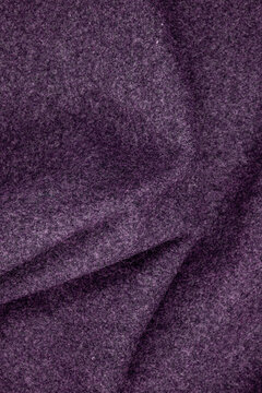 dark purple draped wool fabric with volumetric folds and texture