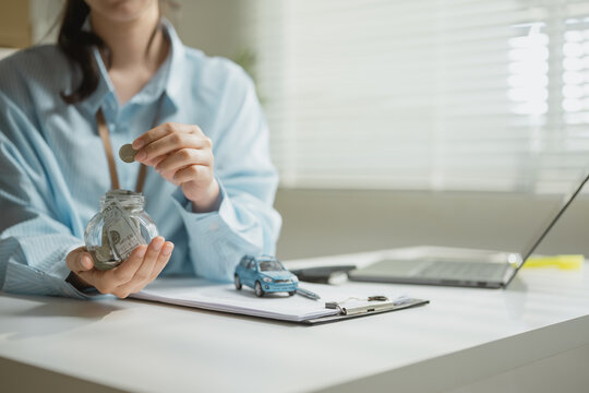 car savings coins with deposit insurance; a car model beside a savings jar and paperwork. car guides buyer choices, savings frames the scene, and coins adds useful meaning. For useful context.