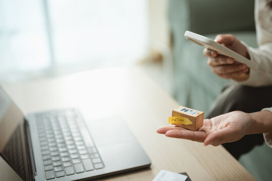 online return parcel with refund customer; a parcel and phone representing an online return request. online guides buyer choices, return frames the scene, and parcel adds useful meaning.