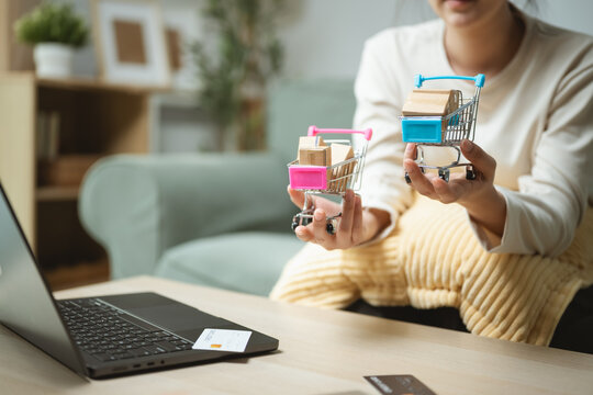 price comparison products with shopping choice; a hand comparing products and prices on a digital screen. price guides buyer choices, comparison frames the scene, and products adds useful meaning.
