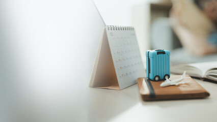 travel planning suitcase with vacation calendar  a suitcase and arranged for a future journey. travel guides buyer choices, planning frames the scene, and suitcase adds useful meaning. © Garun Studios