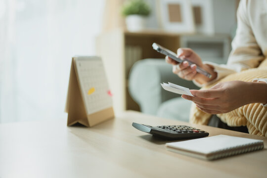 smartphone receipt calculator with expense tracking; a smartphone, receipt, and calculator on a home table. smartphone guides choices, receipt frames meaning, and calculator supports buyers.