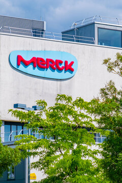Merck Group pharmaceutical company logo, modern building facade global healthcare innovation, scientific research, corporate identity biotechnology industry Darmstadt, Germany, medication production