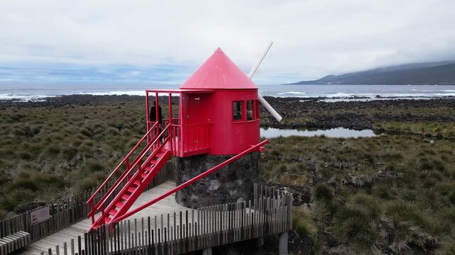 Drone View of Woman Standing at Juncal Mill in Lajes do Pico on Pico Island, Azores, Portugal