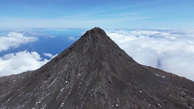 Drone View of People Standing on Pico Mountain, the Highest Peak in Portugal, on Pico Island in the Azores