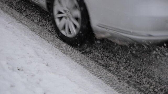 Slow Motion of a Car Driving on a Snow-Covered Road During Winter Conditions