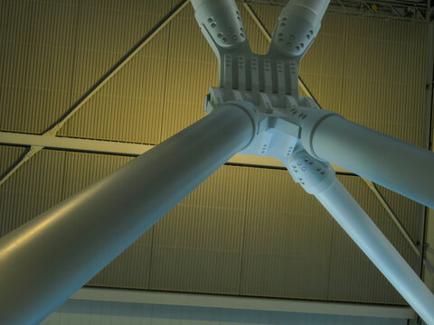 View of the massive white structural steel joint and support beams of the O2 Arena ceiling in London, England, United Kingdom.