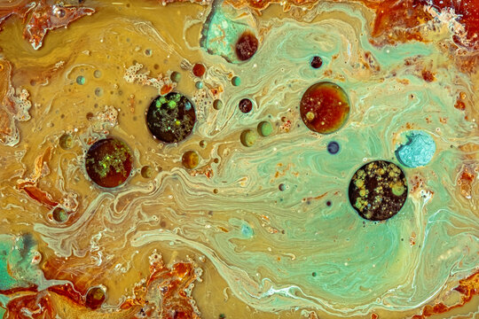 fluid art painting, created using acrylic paint and oil, a marbling effect with colorful bubbles and swirls