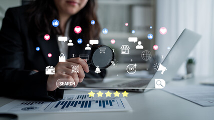 Business professional using magnifying glass to explore digital marketing concepts and social media...