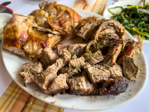 Traditional Greek Easter meat platter with kokoretsi roast lamb and pork kontosouvli closeup view