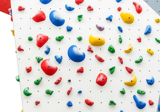 Colorful climbing holds on an indoor rock wall