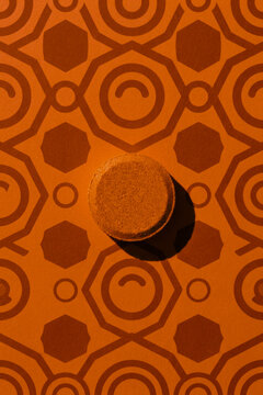 Round textured orange bath bomb on patterned background