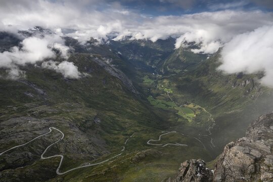 Famous curvy mountain road Fylkesvei 63 or Geirangervegen, which leads from Geiranger to the Djupvasshytta plateau, view of the Geiranger fjord from the 1476 meter high mountain peak and viewpoint Dalsnibba, Stranda, M&oslash;re og Romdal, Norway