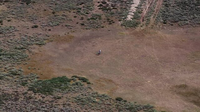 Aerial of family walking across meadow in Uinta Wasatch Cache National Forest in summer