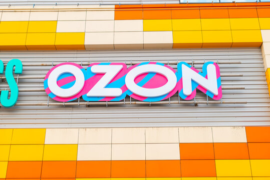  Ozon store online marketplace sign is prominently displayed on a modern building with orange and yellow panels
