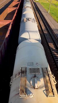 Slow motion top view freight train moving on railway