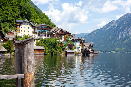 Old wooden houses in Hallstatt, Austria, with Traditional Alpine Buildings, a Lake, and Mountain Cliffs. Hallstatt, Austria - June 22, 2026