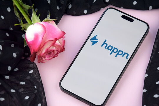 Happn dating app on smartphone screen.