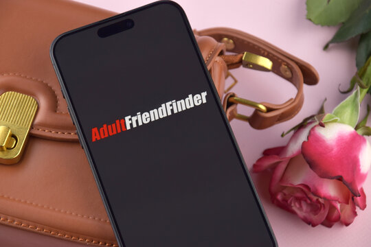 Adultfriendfinder dating app on smartphone screen.