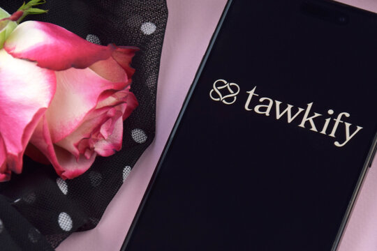 Tawkify dating app on smartphone screen.