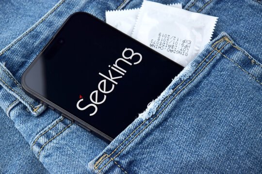 Seeking dating app on smartphone screen.