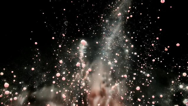 High-impact 4K visual effect clip showcasing a burst of fine colored powder particles exploding violently upward against a dark background creating a dynamic dust cloud overlay