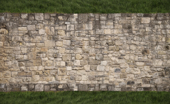 Green grass floor flooring cobbles square textured wall castle fence made of natural grey brown stones rocks bricks Front top aerial view