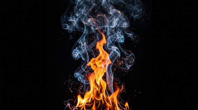 Bright orange flames and swirling grey smoke isolated on a black background with glowing embers and sparks rising upwards