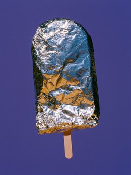 Emergency Blanket Ice Pop with Smooth Reflective Center on Electric Purple Background