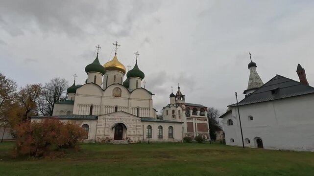 view of the Transfiguration Cathedral and the bell tower with the clock of the Savior-Euthymius Monastery, courtyard, Suzdal