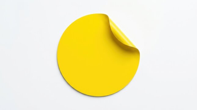 Blank yellow round sticker with a curled corner for notes or labels design isolated on a clean white background isolated on white background