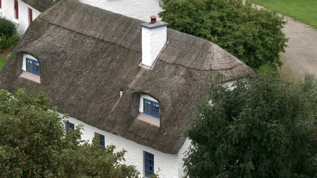 Typical Irish White Washed Houses with Thatched Roof. Authentic and Historical Cozy Cottage in Ireland, Aerial View