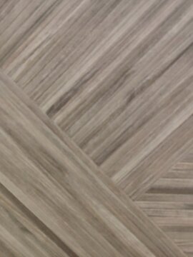Light brown wood grain texture background with modern geometric parquet pattern.
