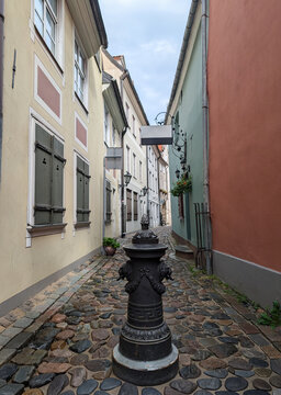 Historical cast iron water hydrant on medieval Troksnu Street in Old Town Riga, Latvia