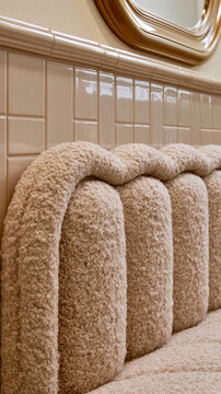 Close Up of Plush Beige Boucle Sofa with Rounded Channel Upholstery