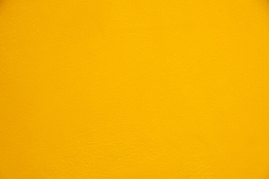 Clean Solid Yellow Plaster Wall Texture for Design Canvas.