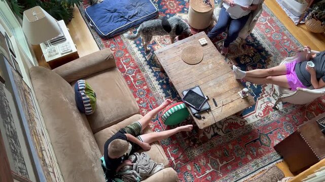 High angle view of family relaxing in living room