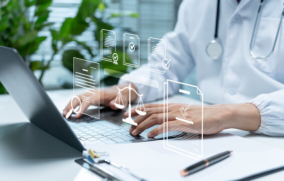 Healthcare professional reviews digital compliance documents on laptop, illustrating medical regulation, legal standards, certification, policy verification, quality assurance, and clinical governance