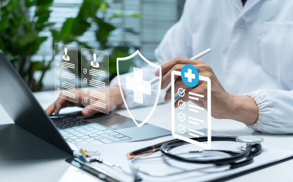 Healthcare professional manages secure digital patient records on laptop, illustrating medical data protection, cybersecurity, privacy, healthcare compliance, information security, and safe technology
